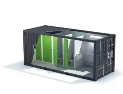 Conteneur maritime aménagé en bloc sanitaire : cabines, WC et lavabos.